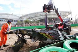 The McLaren MP4-31 of Fernando Alonso, McLaren is removed from the gravel trap after his race stopping crash 