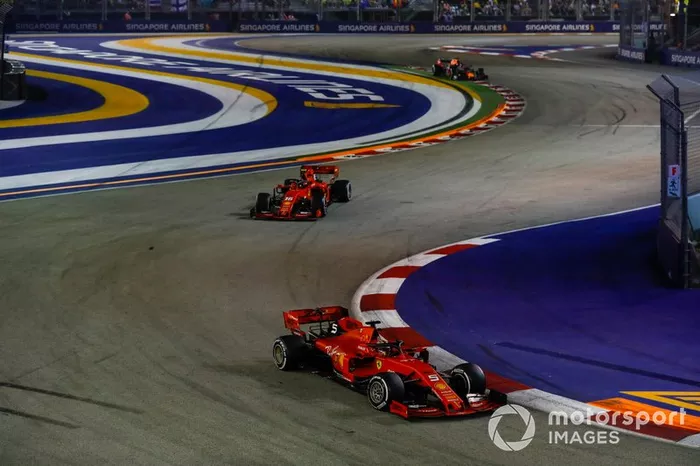 Sebastian Vettel, Ferrari SF90, leads Charles Leclerc, Ferrari SF90