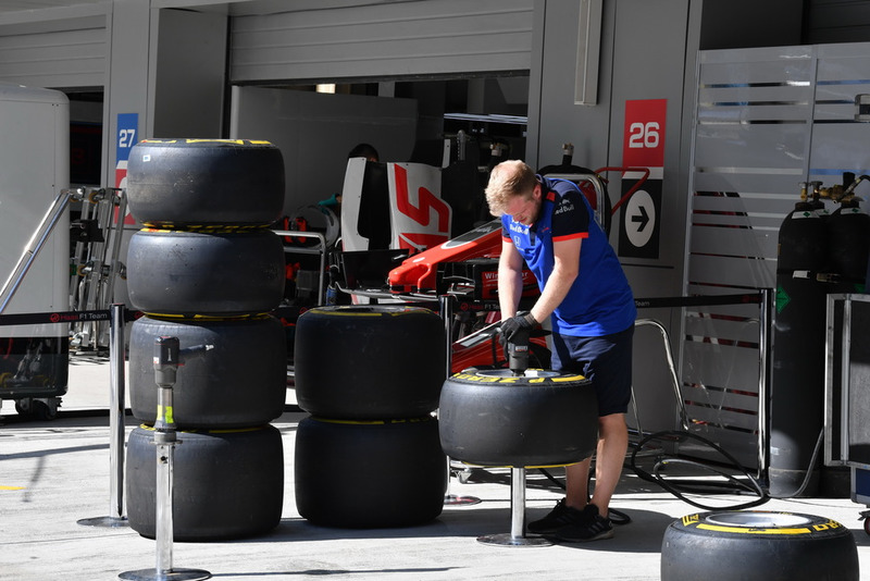 Scuderia Toro Rosso mechanic with Pirelli tyres