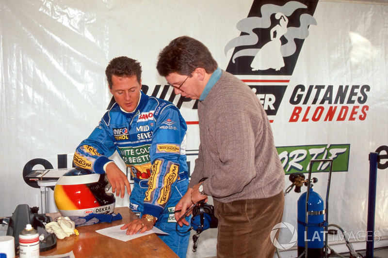 Michael Schumacher and Benetton technical director Ross Brawn evaluate the performance of the Ligier