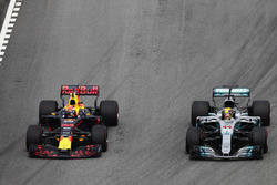 Max Verstappen, Red Bull Racing RB13, passes Lewis Hamilton, Mercedes AMG F1 W08, for the lead