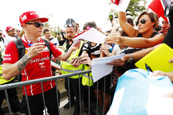 Kimi Raikkonen, Ferrari, signs autographs for his fans