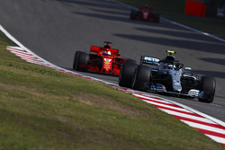 Valtteri Bottas, Mercedes AMG F1 W09, leads Sebastian Vettel, Ferrari SF71H, and Kimi Raikkonen, Ferrari SF71H