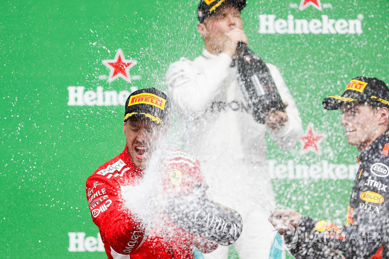 Sebastian Vettel, Ferrari, 1st position, Max Verstappen, Red Bull Racing, 2nd position, and Max Vers