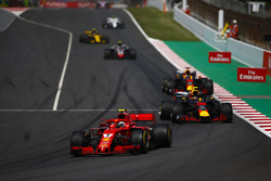 Kimi Raikkonen, Ferrari SF71H, Max Verstappen, Red Bull Racing RB14, and Daniel Ricciardo, Red Bull Racing RB14, behind the safety car