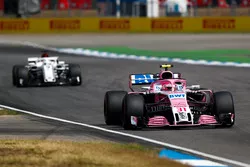 Esteban Ocon, Force India VJM11, leads Marcus Ericsson, Sauber C37