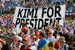Kimi for President banner with fans at the podium