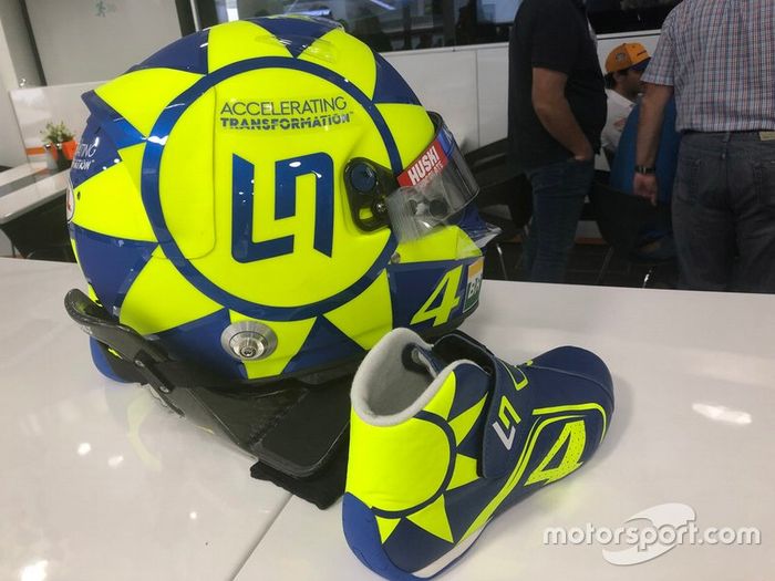 Helmet and boots of Lando Norris, McLaren with the colors of Valentino Rossi