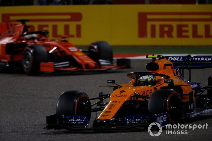 Lando Norris, McLaren MCL34, leads Sebastian Vettel, Ferrari SF90