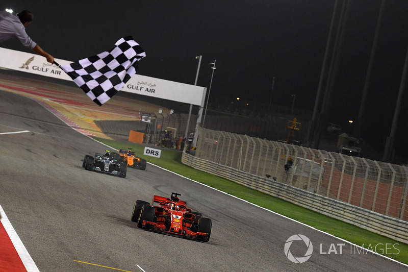 Race winner Sebastian Vettel, Ferrari SF71H crosses the line and takes the chequered flag