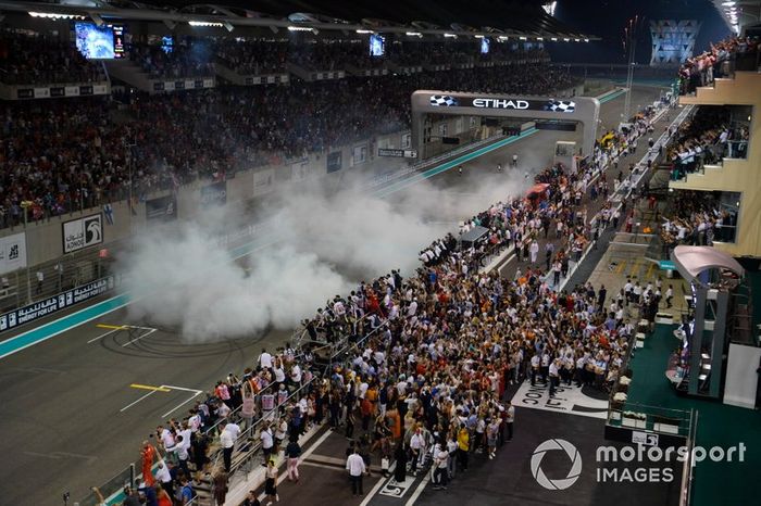 Max Verstappen, Red Bull Racing RB15 and Lewis Hamilton, Mercedes AMG F1 W10, perform donuts