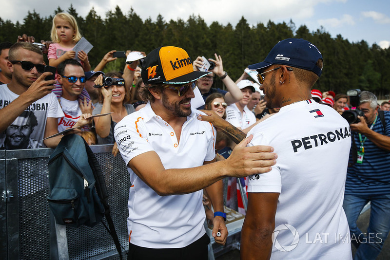 Fernando Alonso, McLaren, is greeted by Lewis Hamilton, Mercedes AMG F1