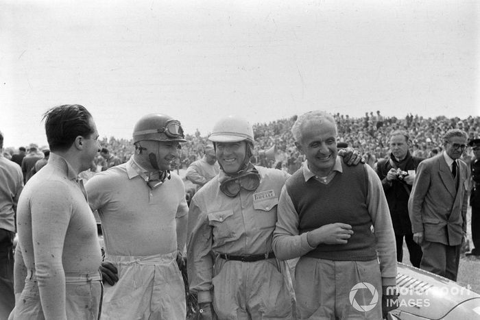 Giuseppe Farina with his winner's garland around his neck
