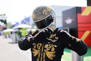 Mario Achi looks on in the Paddock