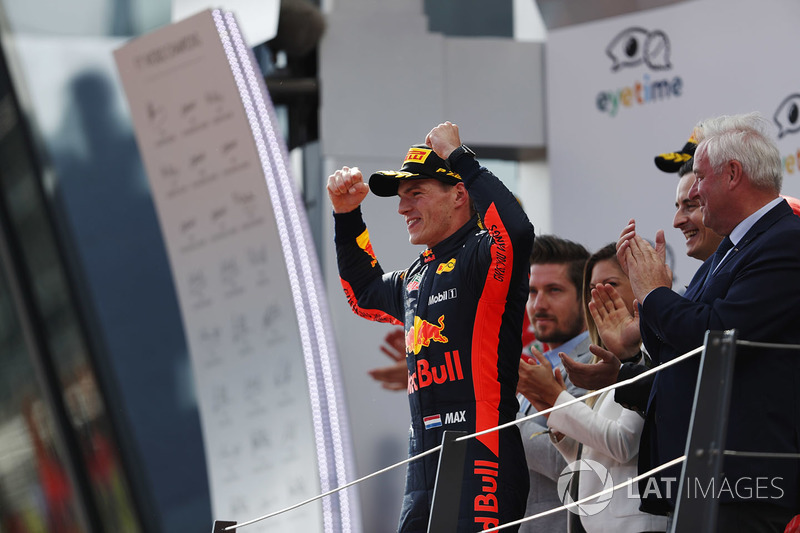 Max Verstappen, Red Bull Racing, celebrates on the podium, along with second place Kimi Raikkonen, Ferrari, and third place Sebastian Vettel, Ferrari