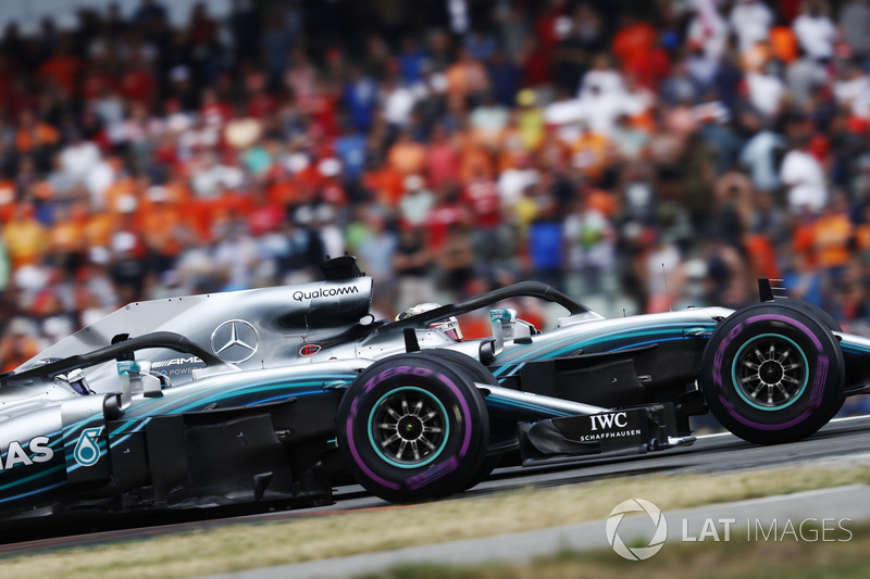 Lewis Hamilton, Mercedes AMG F1 W09, and Valtteri Bottas, Mercedes AMG F1 W09, wave in celebration of victory