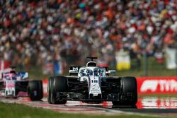 Lance Stroll, Williams FW41, leads Sergio Perez, Force India VJM11