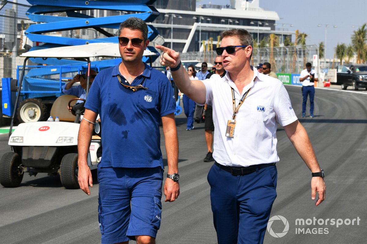 Michael Masi, race director, walks the track with a colleague from the FIA