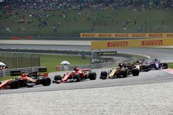 Fernando Alonso, McLaren MCL32 and Sebastian Vettel, Ferrari SF70H at the start of the race