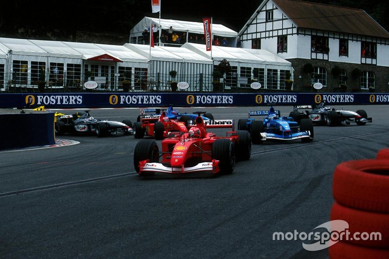 Michael Schumacher, Ferrari F1-2001, takes the lead at the second start whilst Jenson Button,  Benetton Renault B201 made a start into second