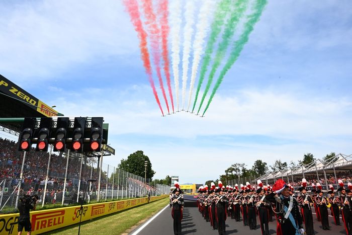 A flyover takes place as the national anthem is performed.