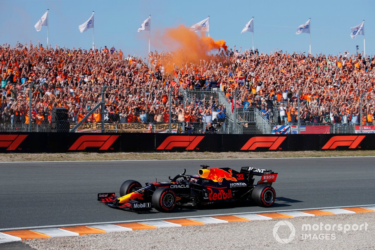 Max Verstappen, Red Bull Racing RB16B, waves to fans on his way to Parc Ferme after securing pole