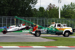 The Williams FW38 of Felipe Massa, Williams is recovered back to the pits on the back of a truck after he crashed in the first practice session
