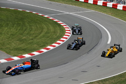 Rio Haryanto, Manor Racing MRT05 leads Sergio Perez, Sahara Force India F1 VJM09; Kevin Magnussen, Renault Sport F1 Team RS16 and Nico Rosberg, Mercedes AMG F1 W07 Hybrid