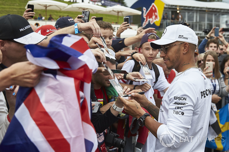 Lewis Hamilton, Mercedes AMG F1, signs autographs for fans