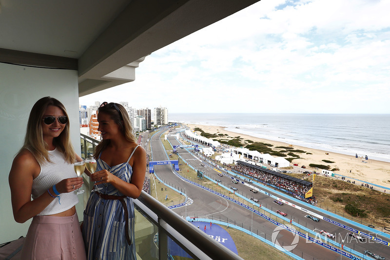 Guests with a glass of champagne as the race starts