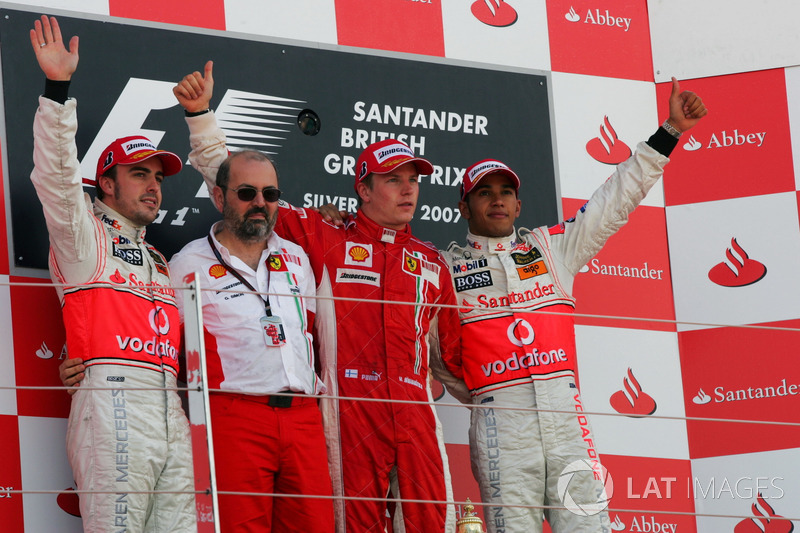 Podium: second place Fernando Alonso, McLaren, Gilles Simon, Ferrari Engine Department, Race winner Kimi Raikkonen, Ferrari, third place Lewis Hamilton, McLaren