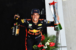 Race winner Daniel Ricciardo, Red Bull Racing celebrates on the podium with the trophy