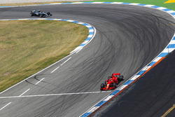 Sebastian Vettel, Ferrari SF71H, leads Valtteri Bottas, Mercedes AMG F1 W09