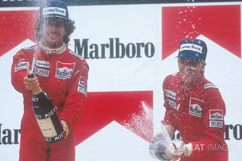 Podium: race winner Alain Prost, McLaren, second place Stefan Johansson, McLaren