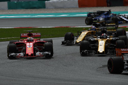 Sebastian Vettel, Ferrari SF70H and Nico Hulkenberg, Renault Sport F1 Team RS17 battle