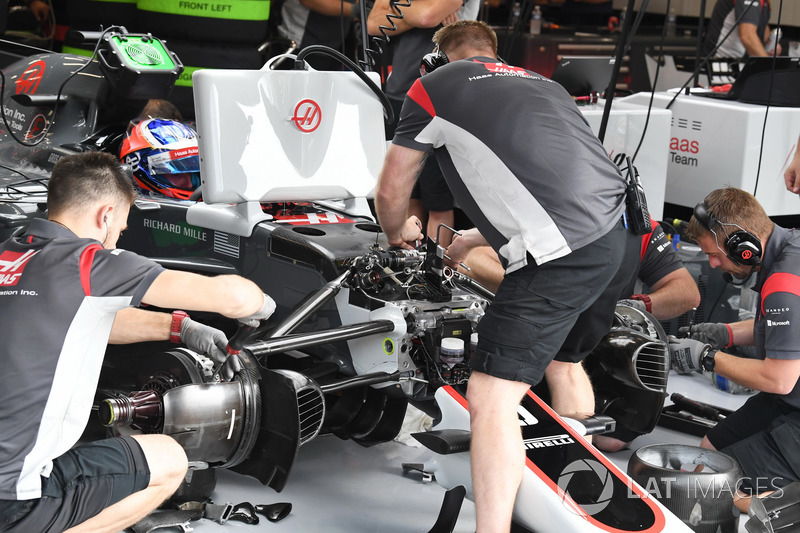 Haas F1 mechanics work on the Haas F1 Team VF-17 or Romain Grosjean, Haas F1