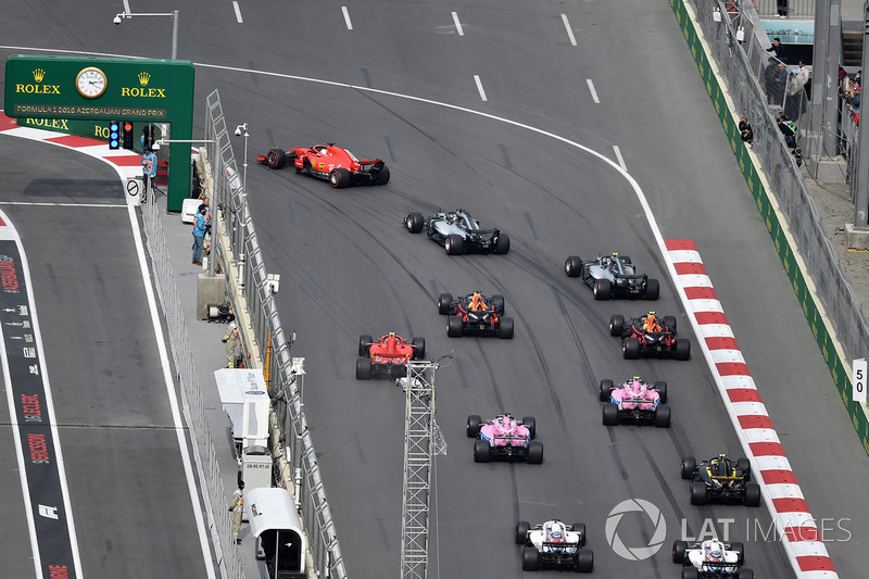 Sebastian Vettel, Ferrari SF71H leads Lewis Hamilton, Mercedes-AMG F1 W09 EQ Power+ at the start of the race