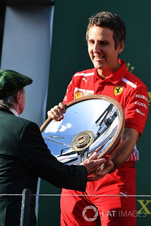 Inaki Rueda, Ferrari Race Strategist celebrates with the trophy on the podium