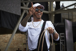 Lewis Hamilton, Mercedes AMG F1, on stage with a lasso