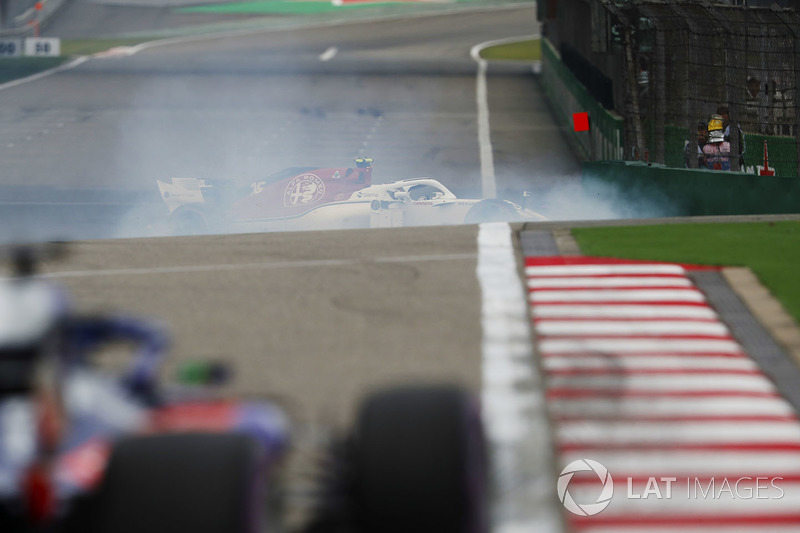 Charles Leclerc, Sauber C37 Ferrari, spins in front of a Toro Rosso