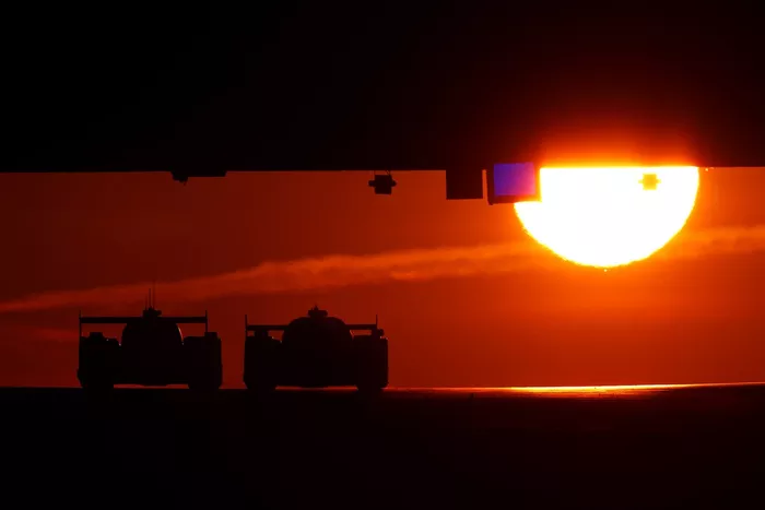 Drivers make their way under Dunlop Bridge at sunrise