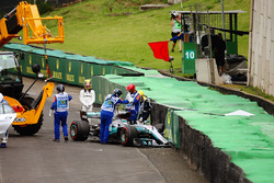 Lewis Hamilton, Mercedes AMG F1 W08, stands by his damaged car after crashing out of Q1