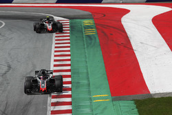 Romain Grosjean, Haas F1 Team VF-18, leads Kevin Magnussen, Haas F1 Team VF-18, to the grid