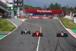 Kimi Raikkonen, Ferrari SF71H, Sebastian Vettel, Ferrari SF71H and Valtteri Bottas, Mercedes AMG F1 W09