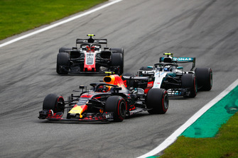 Max Verstappen, Red Bull Racing RB14, leads Valtteri Bottas, Mercedes AMG F1 W09, and Kevin Magnussen, Haas F1 Team VF-18