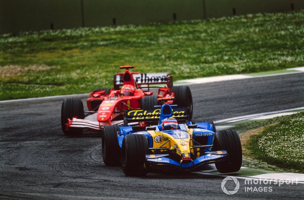 Fernando Alonso, Renault R25, leads Michael Schumacher, Ferrari F2005