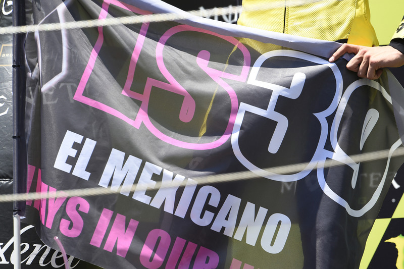 Alex Rins, Paginas Amarillas HP 40 holding Luis Salom flag on podium