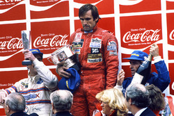Podium: race winner Carlos Reutemann, Williams, second place Jacques Laffite, Talbot Ligier Matra, third place Nigel Mansell, Team Lotus