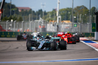 Valtteri Bottas, Mercedes AMG F1 W09, leads Lewis Hamilton, Mercedes AMG F1 W09, and Sebastian Vettel, Ferrari SF71H