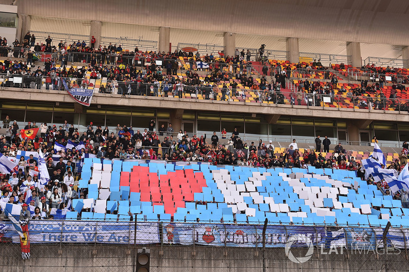 Kimi Raikkonen, Ferrari fans and banner